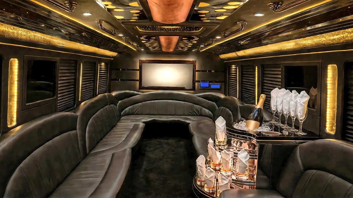 Inside the Ford F-550 Party Bus, with wraparound leather lounge seating, a starlight ceiling and a bar