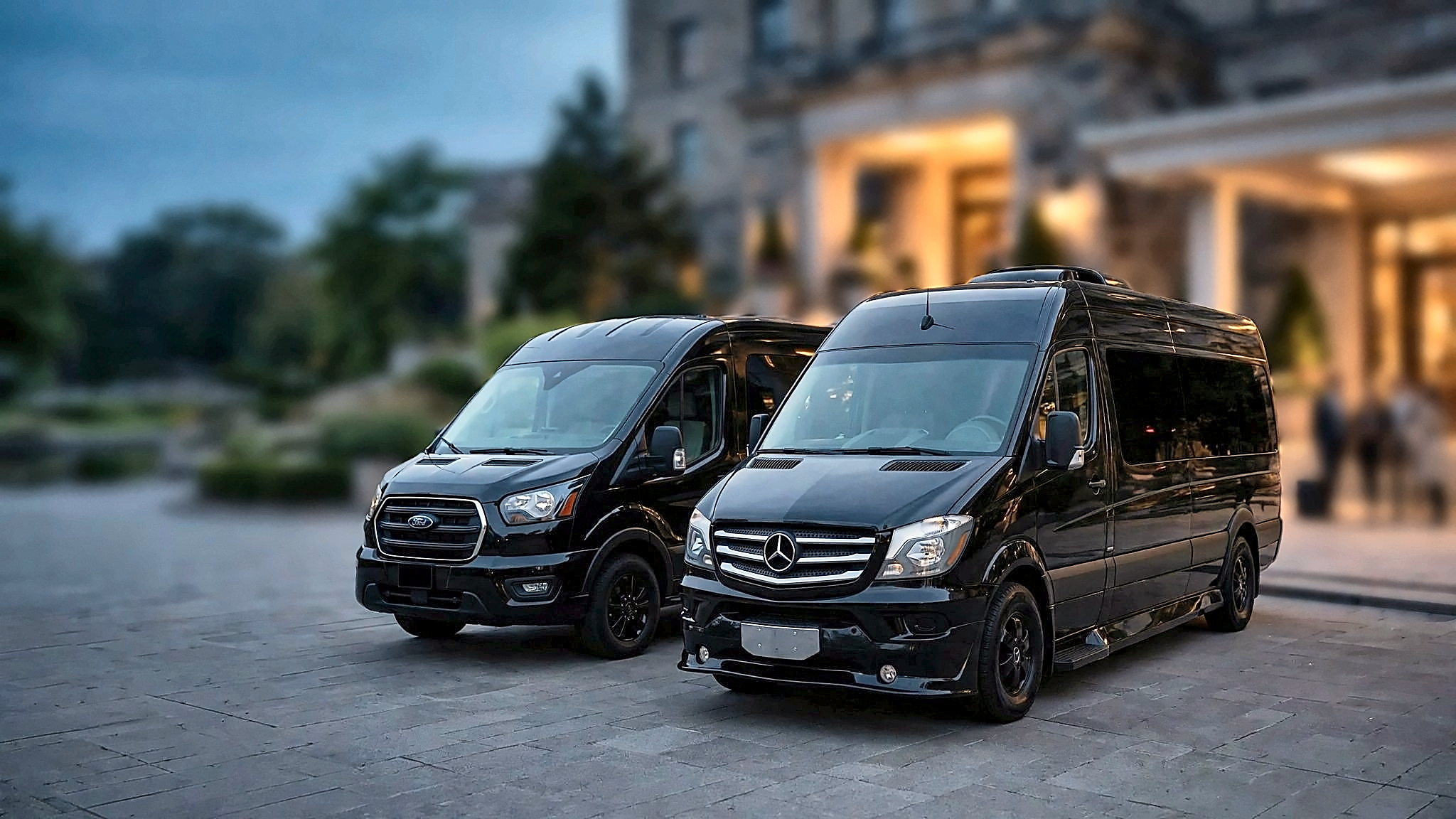 The black Mercedes-Benz Sprinter and Ford Transit with a group of passengers at a Toronto hotel