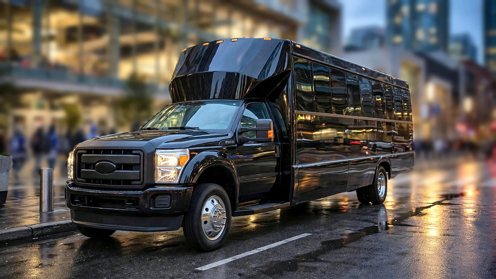 Concert and sporting event transportation: the black Ford F-550 party bus outside a Toronto arena on game night