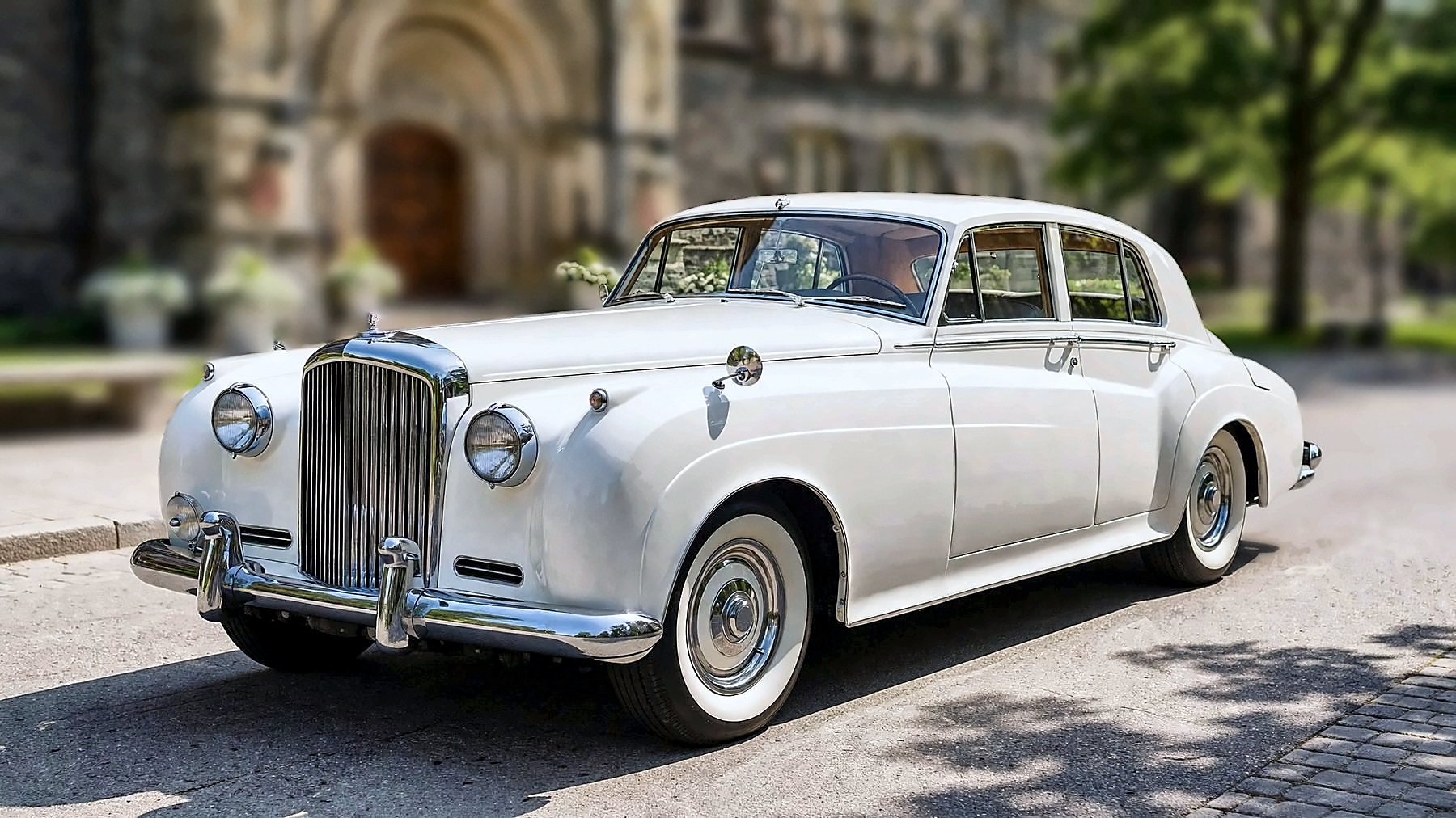 The white 1959 Bentley S on a university campus