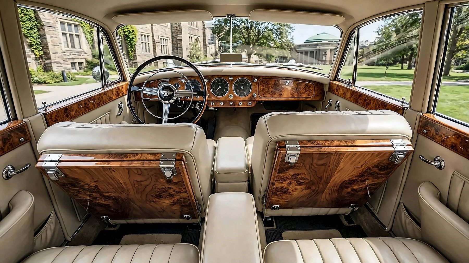 The cream leather interior and walnut picnic tables of the 1959 Bentley S