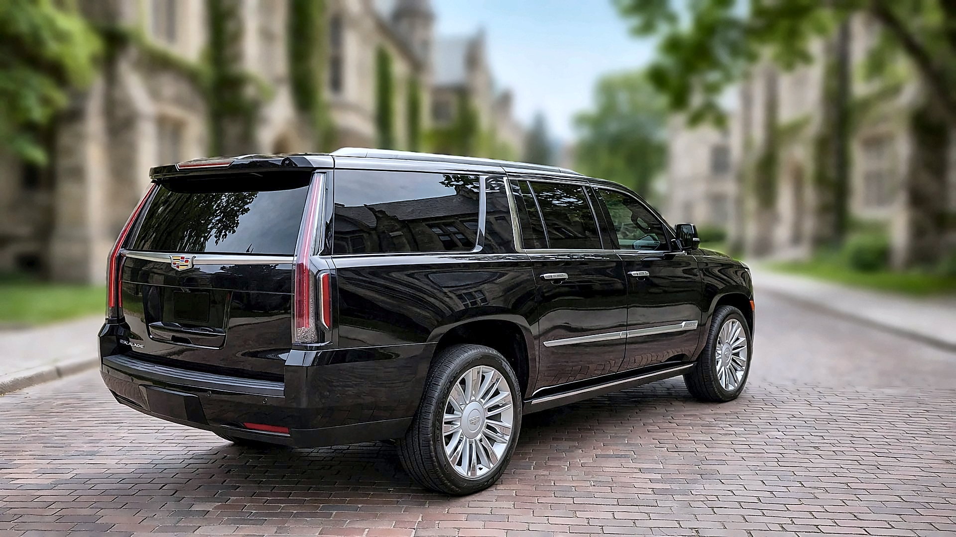 The black Cadillac Escalade ESV from the rear on a university campus