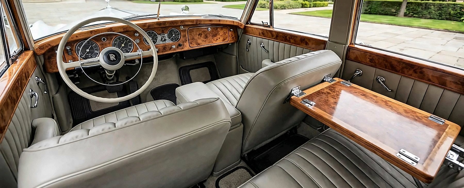 Inside the 1959 Rolls-Royce, with grey leather seating and burr walnut trim